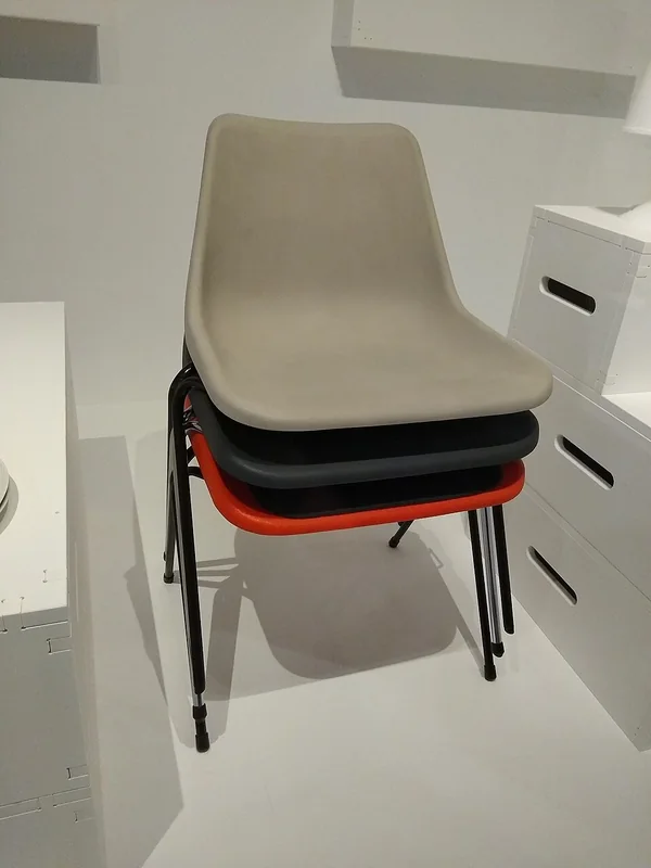 Moulded plastic chairs with metal legs