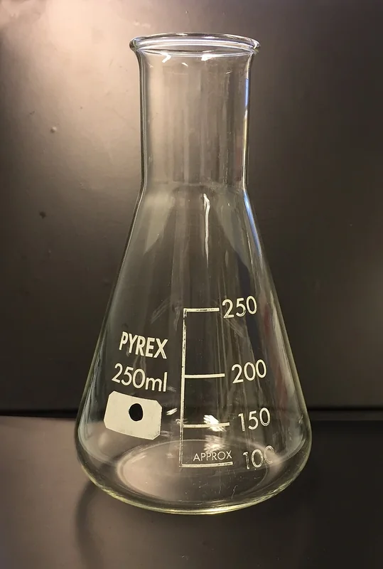 Clear conical laboratory flask with a narrow neck