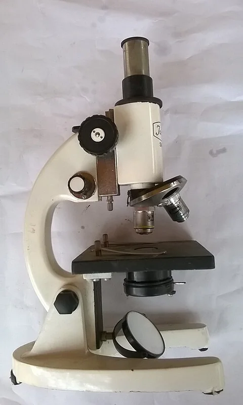 Monocular compound microscope with objective lenses and a specimen stage
