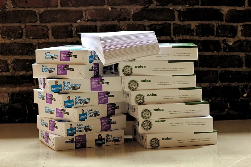 Wrapped reams of printing paper stacked together
